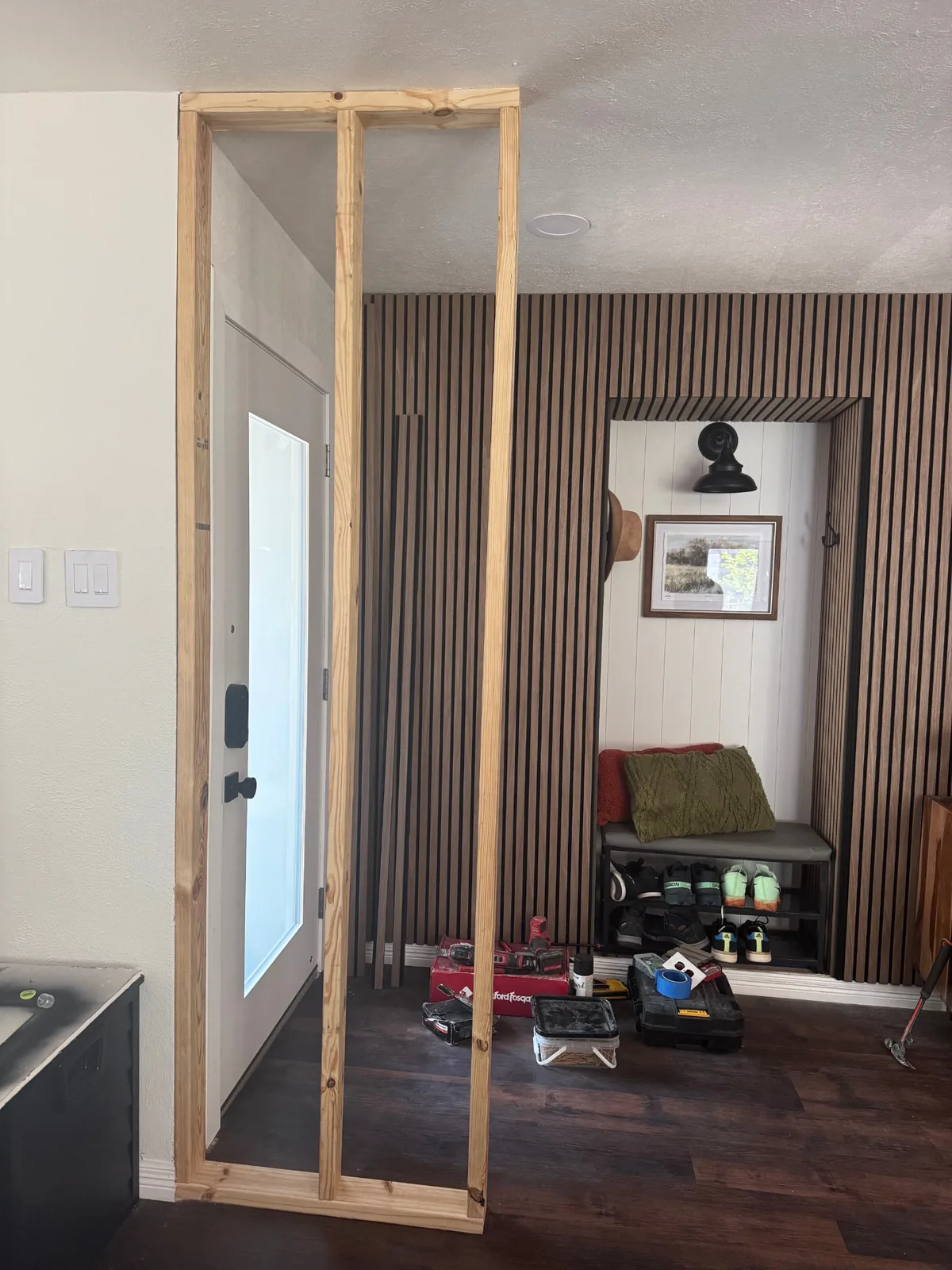 Wide view of the Bright Build entryway transformation during final installation.